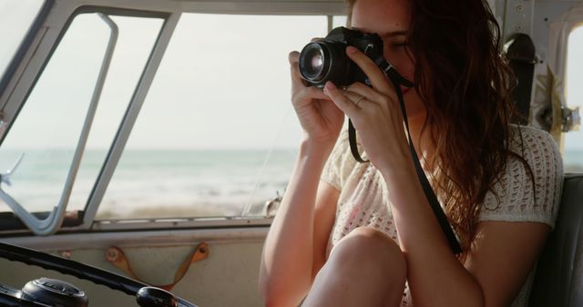 Young Woman Taking Photos from Inside Car by Beach - Download Free Stock Images Pikwizard.com