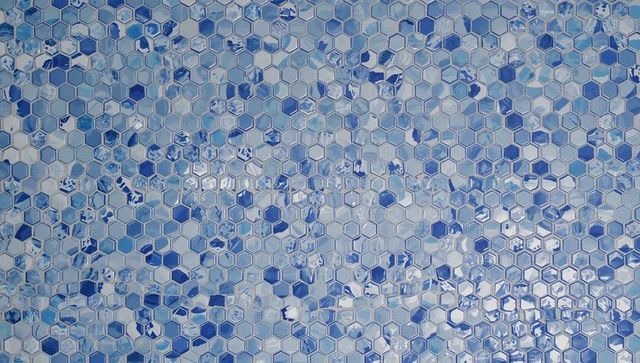 Blue hexagonal mosaic tile pattern with glossy reflective honeycomb surface