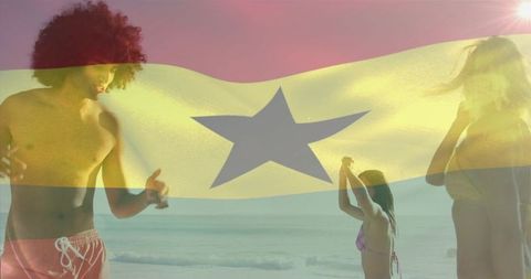 Friends enjoying sunset beach party while waving gold star flag and posing in swimwear