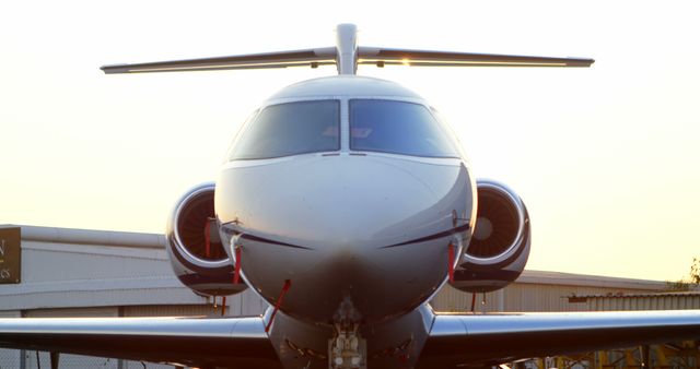 Close-Up Front View of Private Jet at Sunset - Download Free Stock Images Pikwizard.com