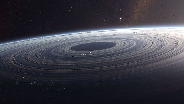 Ringed planet with concentric debris rings curving past horizon over starfield and dark gap