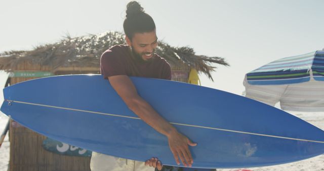 Surfer Preparing Surfboard on Beach - Download Free Stock Images Pikwizard.com