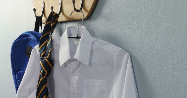 School Uniform Shirt and Tie on Wall Hooks - Download Free Stock Images Pikwizard.com