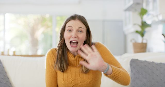 Woman Greeting Excitedly from Cozy Home Living Room - Download Free Stock Images Pikwizard.com