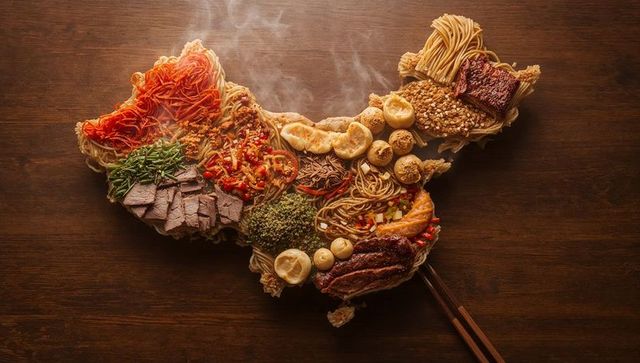 Map-shaped traditional asian culinary creation on wooden table