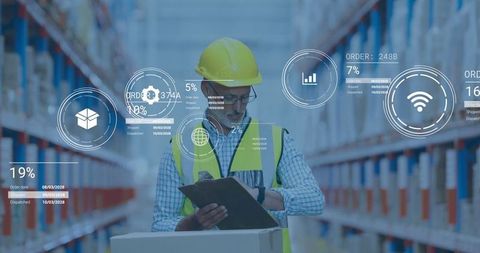 Warehouse worker reviewing orders on clipboard with digital graphics