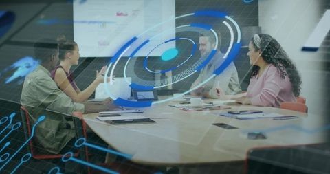 Diverse Team Collaborating with Digital Analytics in Modern Meeting Room