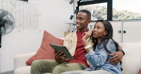 Couple Relaxing with Tablet at Home Living Joyful Lifestyle