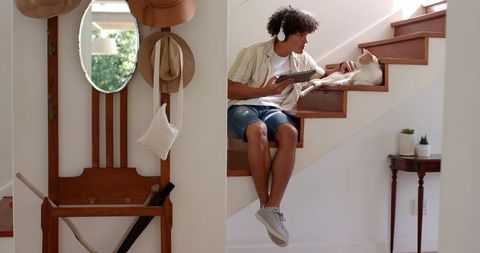 Man Relaxing with Cat on Cozy Staircase at Home Listening to Music