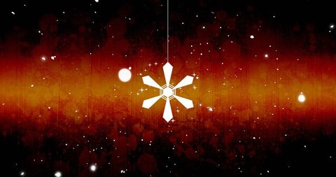 Abstract snowflake hanging against festive glowing background