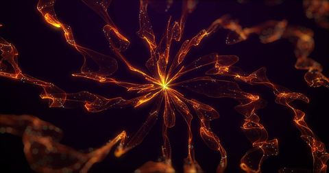 Abstract orange light trails in hypnotic motion