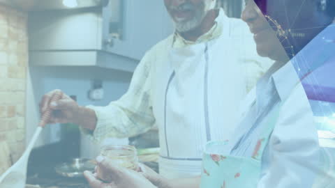 Senior Couple Cooking and Exploring Digital Technology