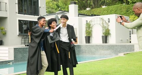 Diverse Graduates Celebrating Achievement Together by Poolside