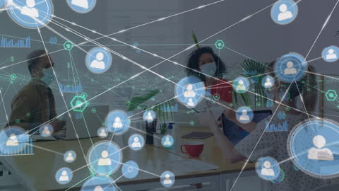 Digital Connections Amidst Business Team Meeting in Office