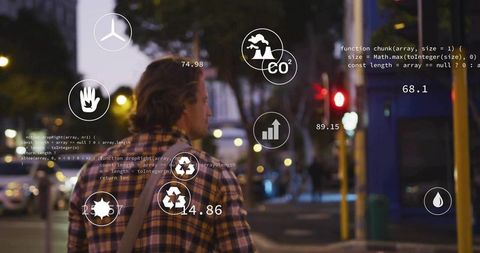 Man Walking City Street with Sustainabilty Technology Icons Overlay