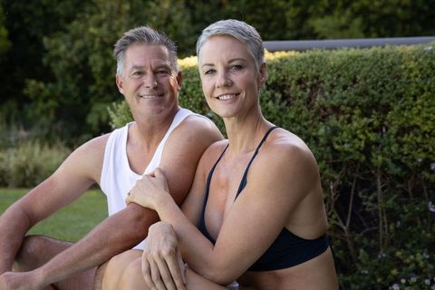 Senior Couple Enjoying Sunny Day on Lawn Embracing Life
