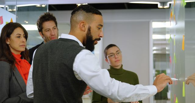 Focused Diverse Team Brainstorming on Office Whiteboard - Download Free Stock Images Pikwizard.com