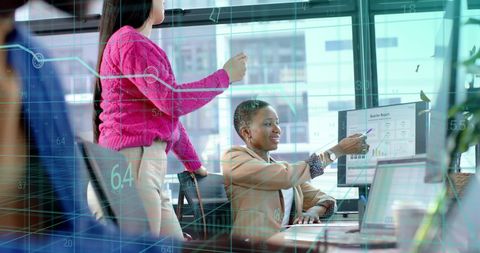 Diverse Businesspeople Analyzing Financial Data in Bright Office