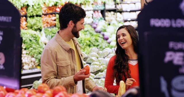 Couple selecting vegetables from organic section in supermarket - Download Free Stock Photos Pikwizard.com