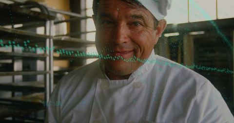 Professional Chef in Industrial Bakery Handling Trays