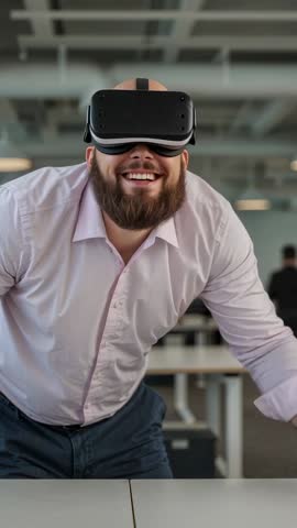 Bearded Professional Starting VR Simulation Leaning Over Office Desk Vertical Video