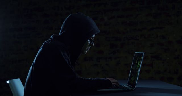 Anonymous Hacker Using Laptop in Dark Room - Download Free Stock Images Pikwizard.com