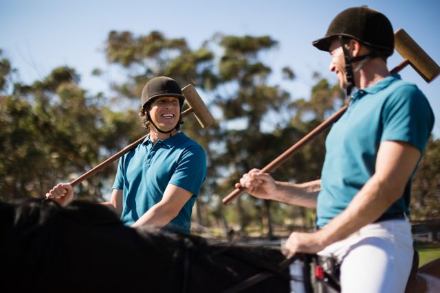 Two male jockeys riding horse in the ranch - Download Free Stock Photos Pikwizard.com