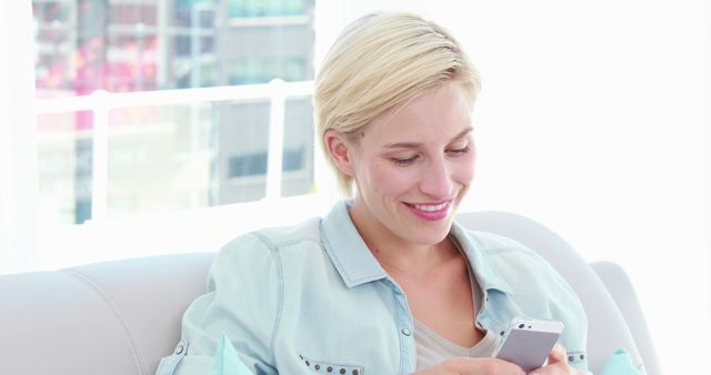 Woman Relaxing on Couch Using Smartphone Indoors Bright Light - Download Free Stock Images Pikwizard.com