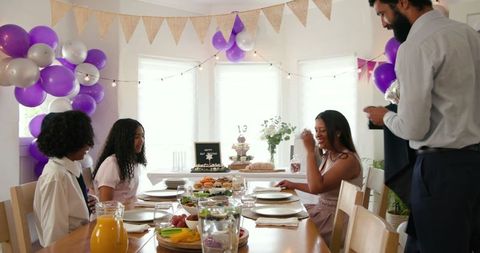 Family Celebrating at Home with Festive Decorations