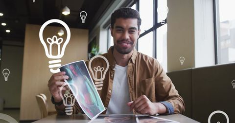 Creative Businessman Holding Photo with Lightbulb Illustrations