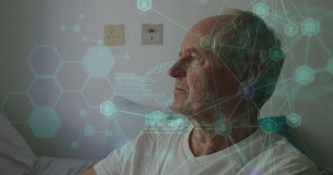 Elderly Man Relaxing with Holographic Technology in Hospital Room