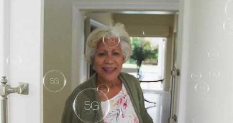 Smiling Senior Woman Opening Door with 5G Concept Overlay