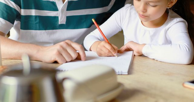 Father and Daughter Doing Homework Together at Home - Download Free Stock Images Pikwizard.com