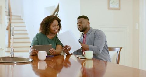 African American Couple Reviewing Finances at Home