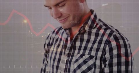 Man in Checkered Shirt Reviewing Data Visualization Concept