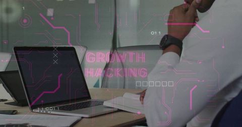 Businessman thinking at laptop with growth hacking overlay and magenta circuit interface
