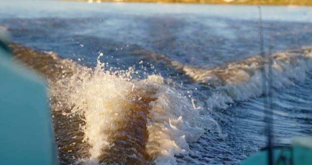 Water splashes at the stern of a boat, indicating movement - Download Free Stock Photos Pikwizard.com