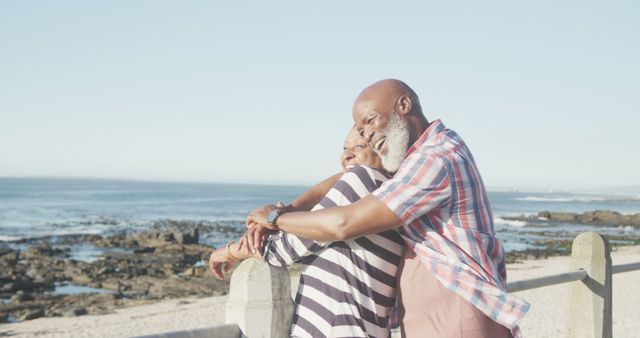 Happy African American Senior Couple Embracing on Sunny Beach - Download Free Stock Images Pikwizard.com