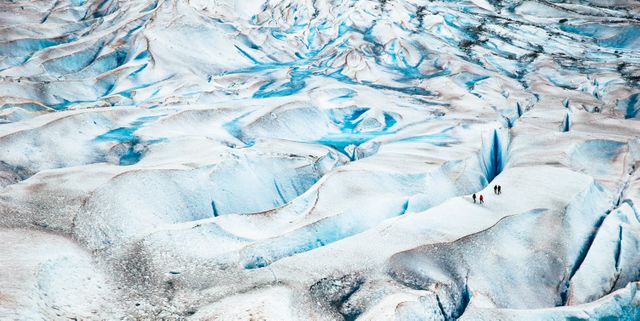Travelers Exploring Expansive Glacier Landscape - Download Free Stock Photos Pikwizard.com