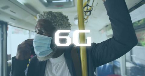 Commuter standing on city bus adhering to health precautions with mask
