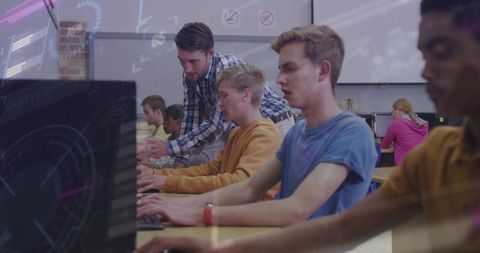 Instructor Guiding Teen Students Typing in High School Computer Lab for Coding Class