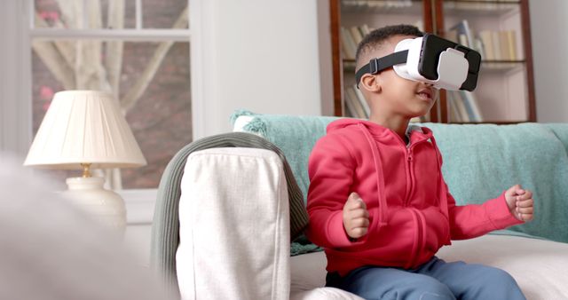 Excited Kid Wearing VR Headset in Cozy Living Room - Download Free Stock Images Pikwizard.com