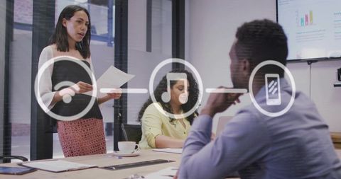 Businesswoman Presenting in Meeting Room with Digital Interface Overlay