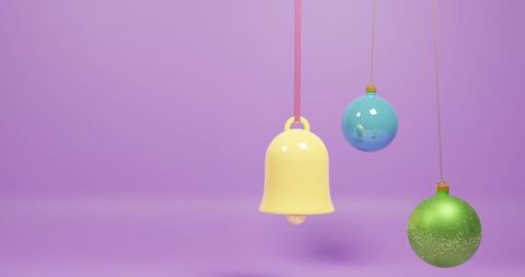 Colorful festive ornaments against purple background