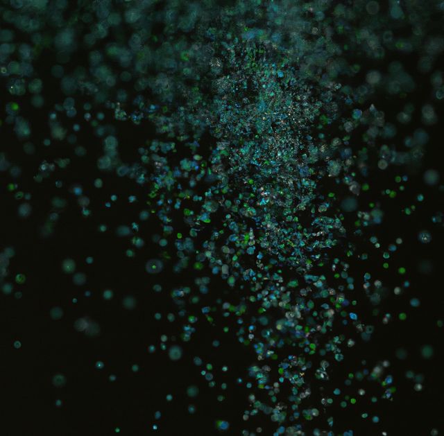 Image of close up of multiple green particles on dark background - Download Free Stock Photos Pikwizard.com