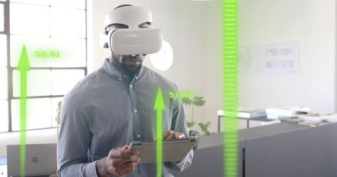 Man using vr headset with augmented reality in modern office