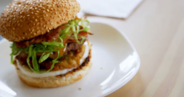 Delicious Gourmet Burger with Sesame Seed Bun and Fresh Vegetables - Download Free Stock Images Pikwizard.com