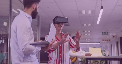 Corporate Team Engaging with Virtual Reality in Modern Office