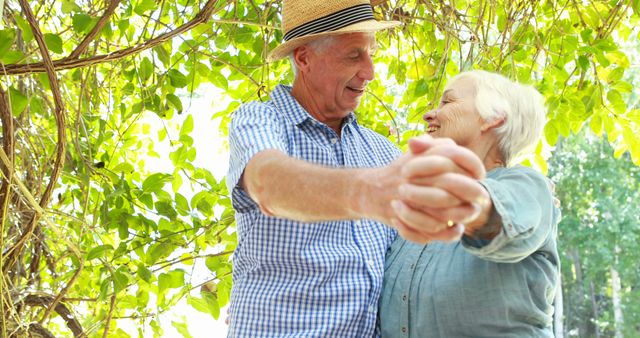 Senior couple dancing together outdoor