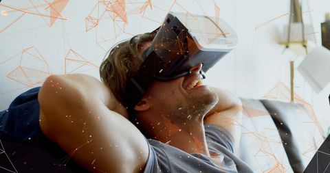 Man experiencing vr entertainment with digital network elements